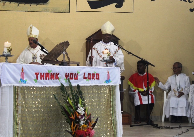 Bishop Peter Houhou takes his crosier and besides his cathedra